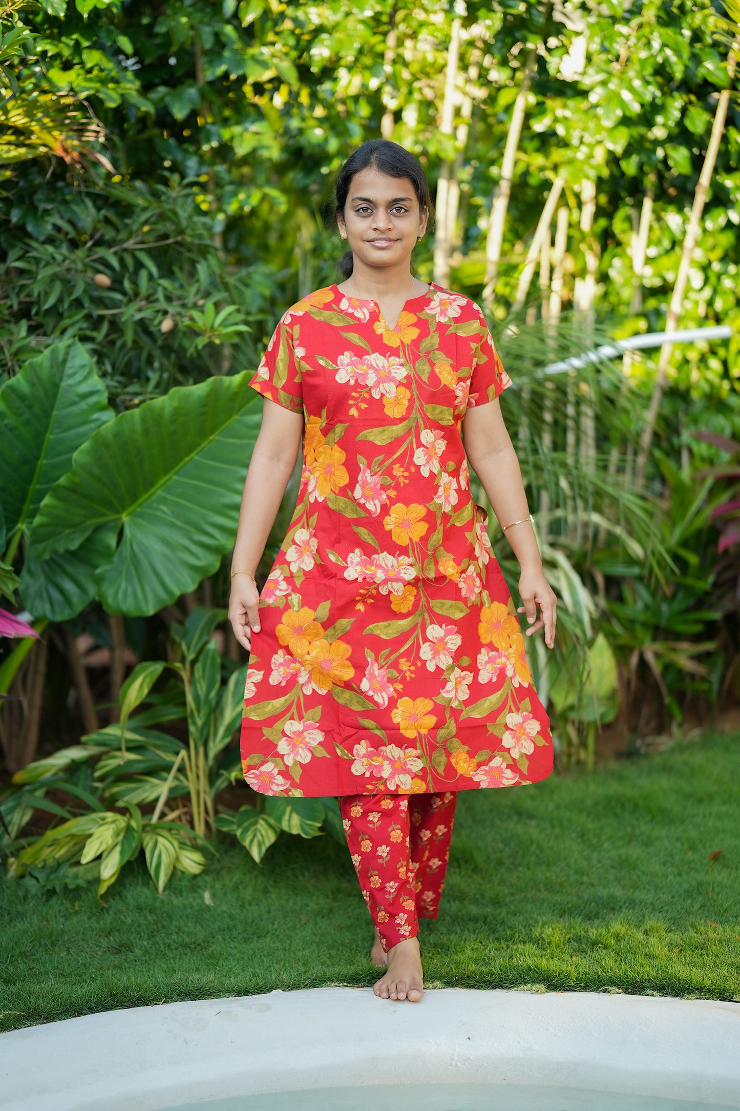 Front view of the Krithi red printed cotton night suit showcasing the V-slit neckline and comfortable loungewear design.
