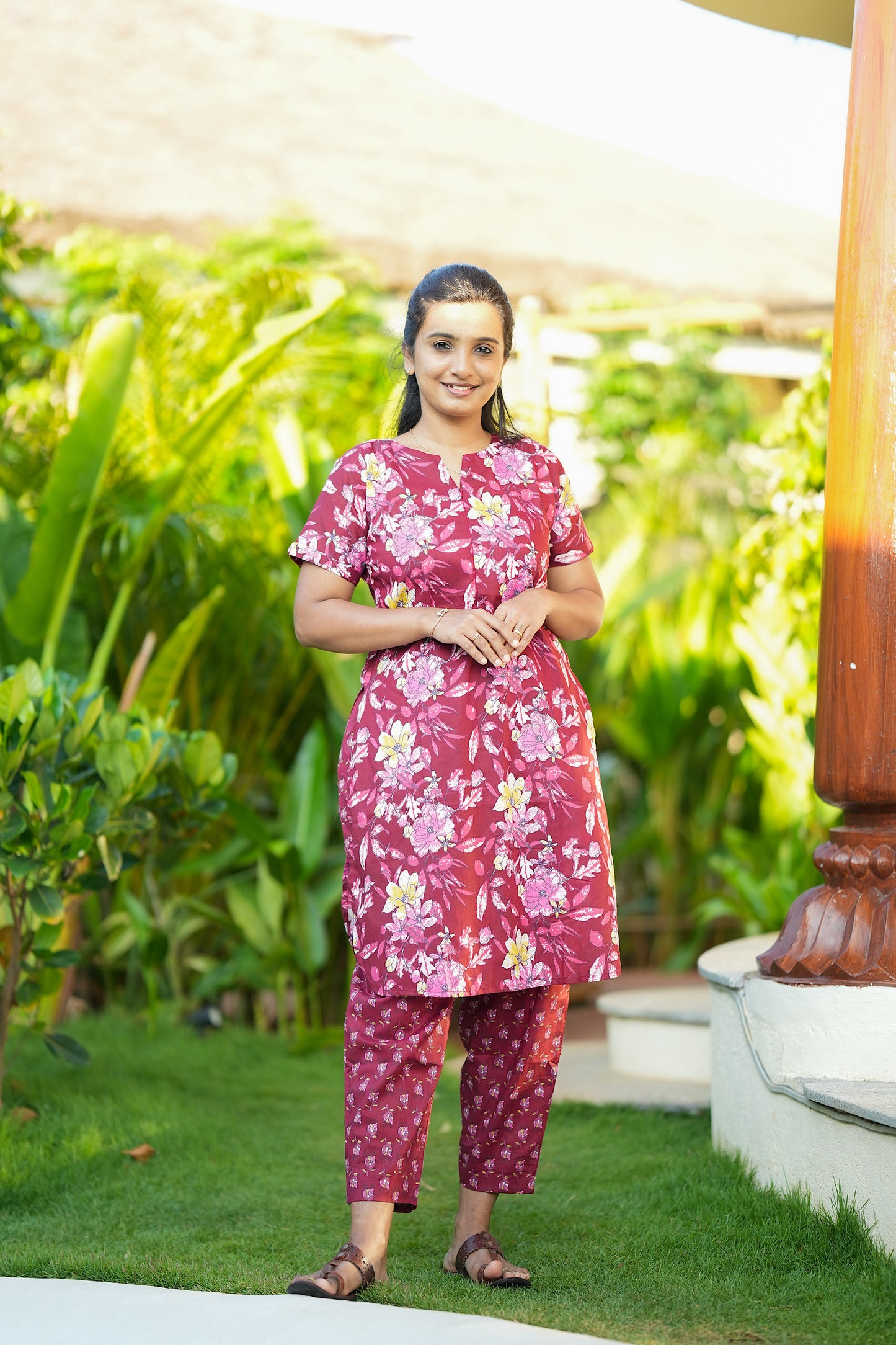 Comfortable cotton nightwear set in berry pink with a detailed floral pattern and V-slit neckline.