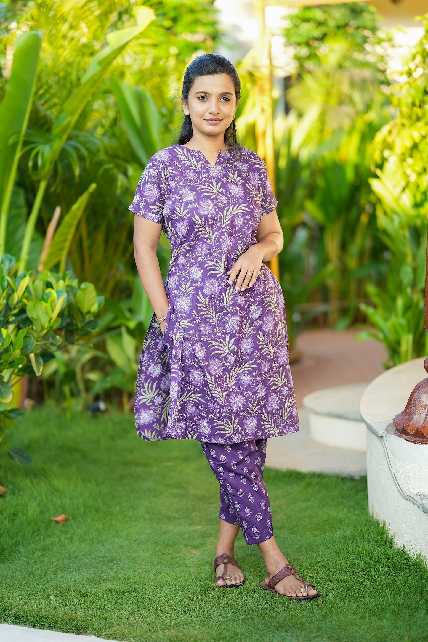Purple ladies nightwear set with a relaxed-fit long top and matching ankle-length pants.