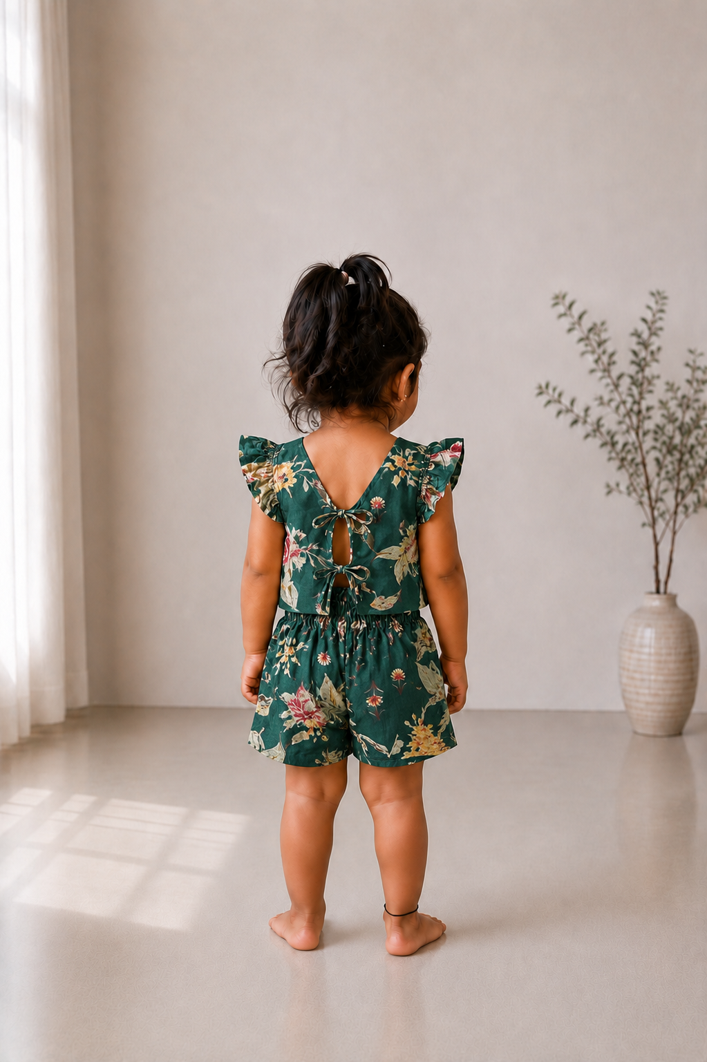 Back view of Adhira kids floral dress set showing double tie-up bow details