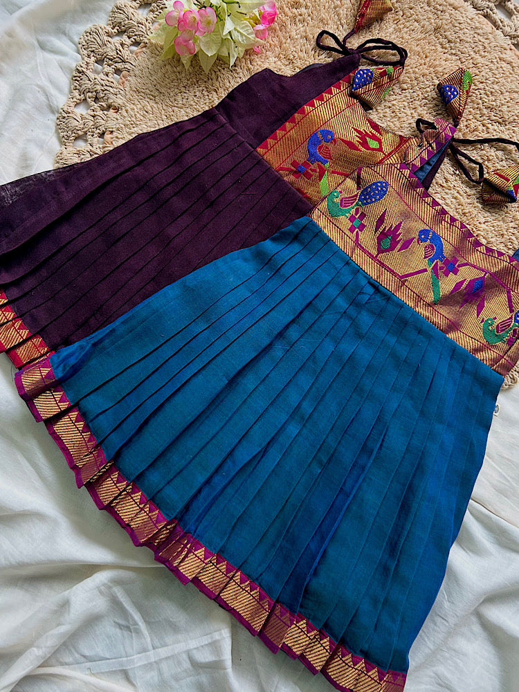 Brown and peacock blue paithani frocks for girls side by side