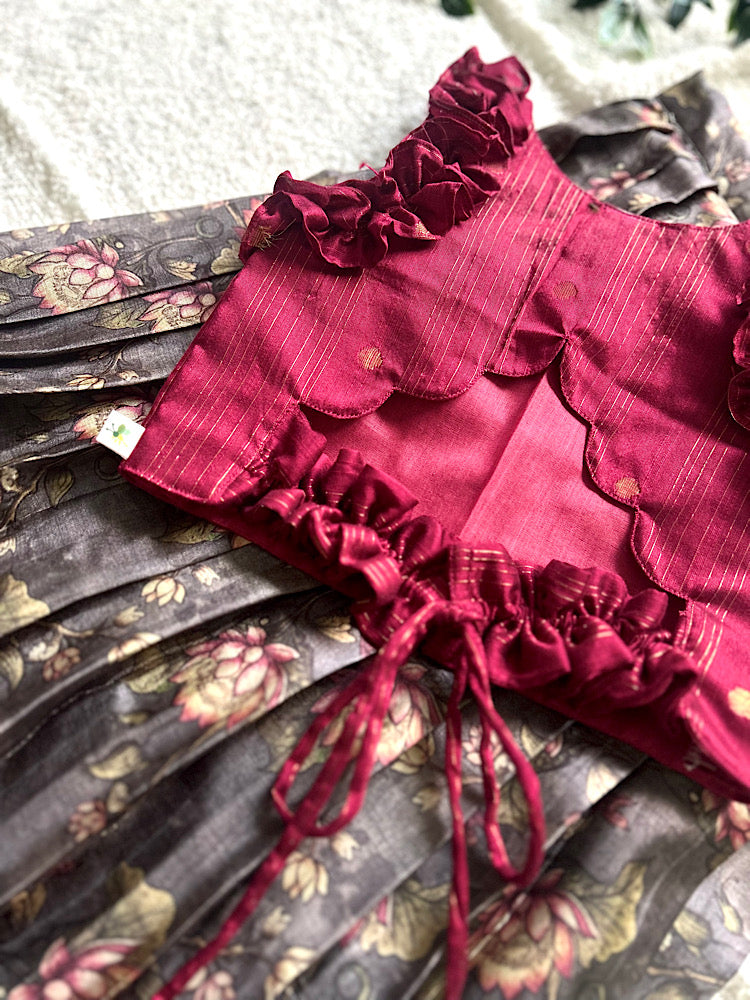 Close up of maroon raw silk crop top with zari stripes and back tie-up