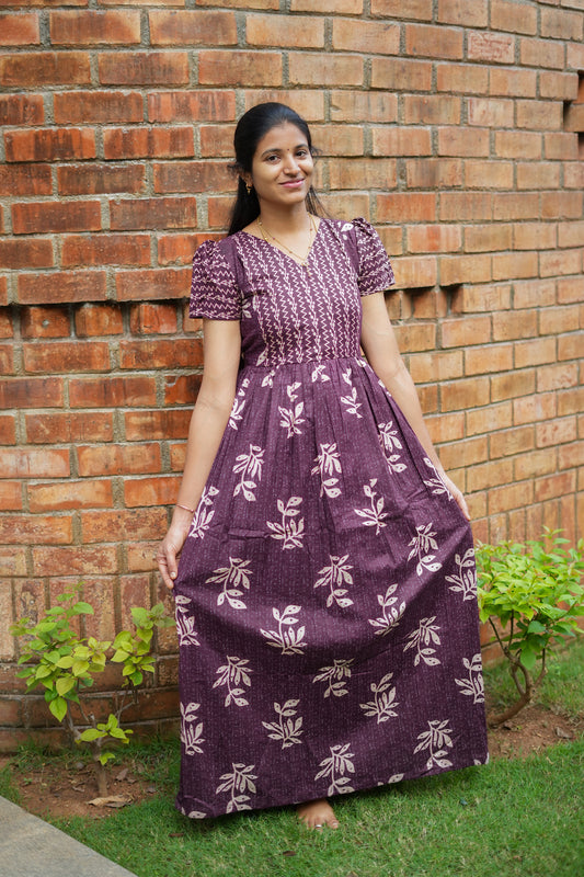 Full view of ladies cotton night dress in deep plum with leaf print