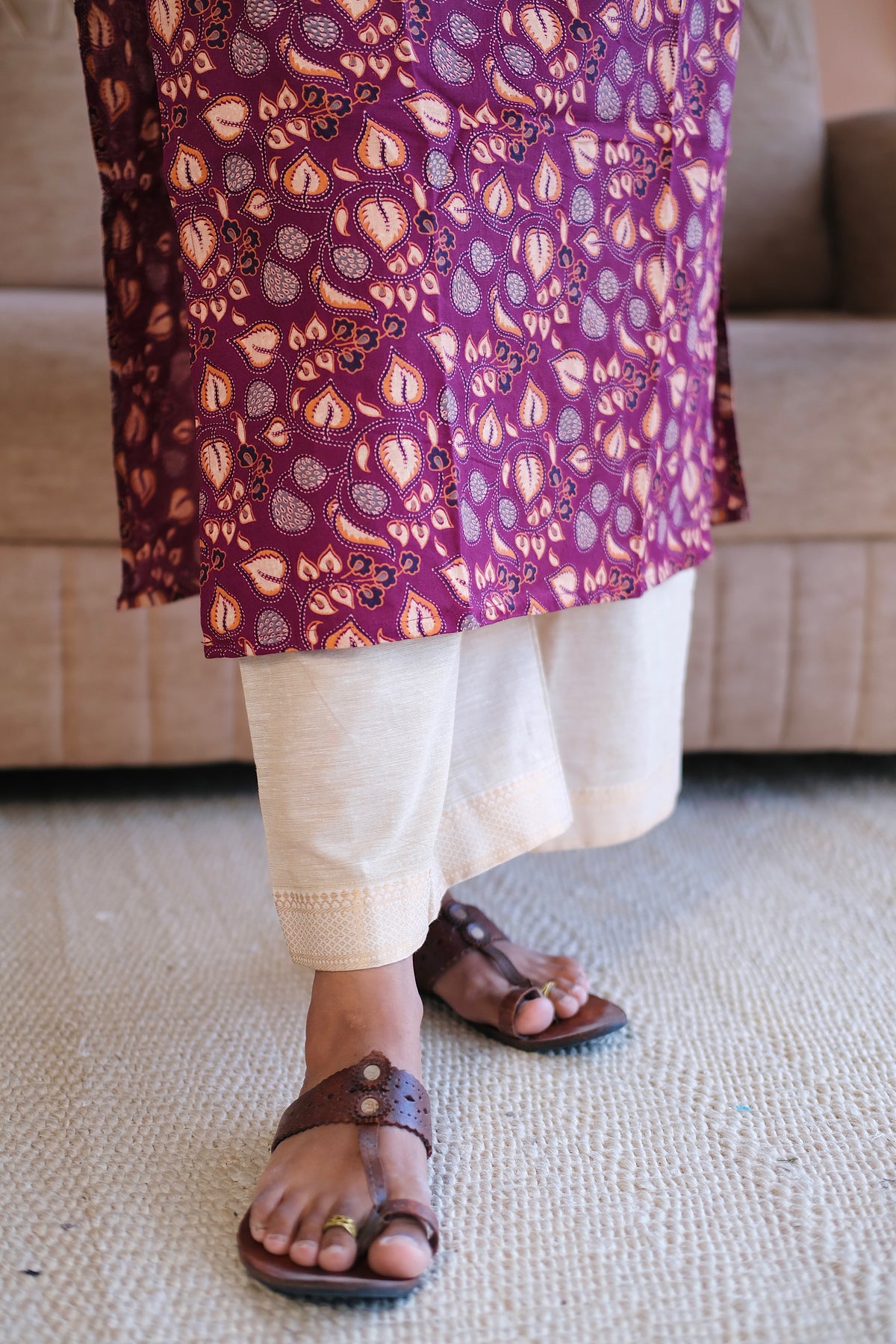 Close up of the plum printed cotton fabric and hemline detail
