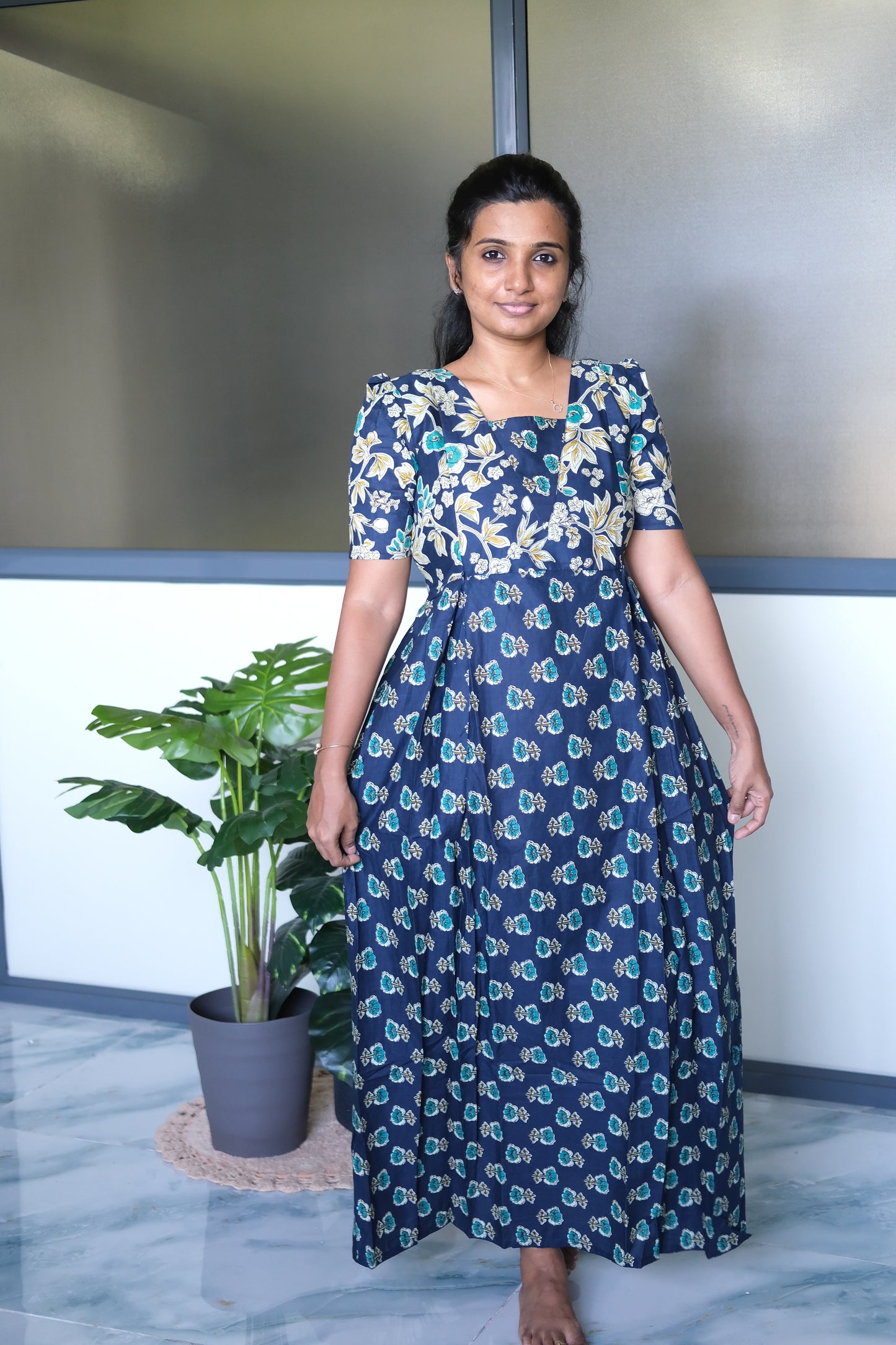 Full-length front view of the dark blue cotton maxi nighty draped elegantly, highlighting the comfortable flared silhouette.