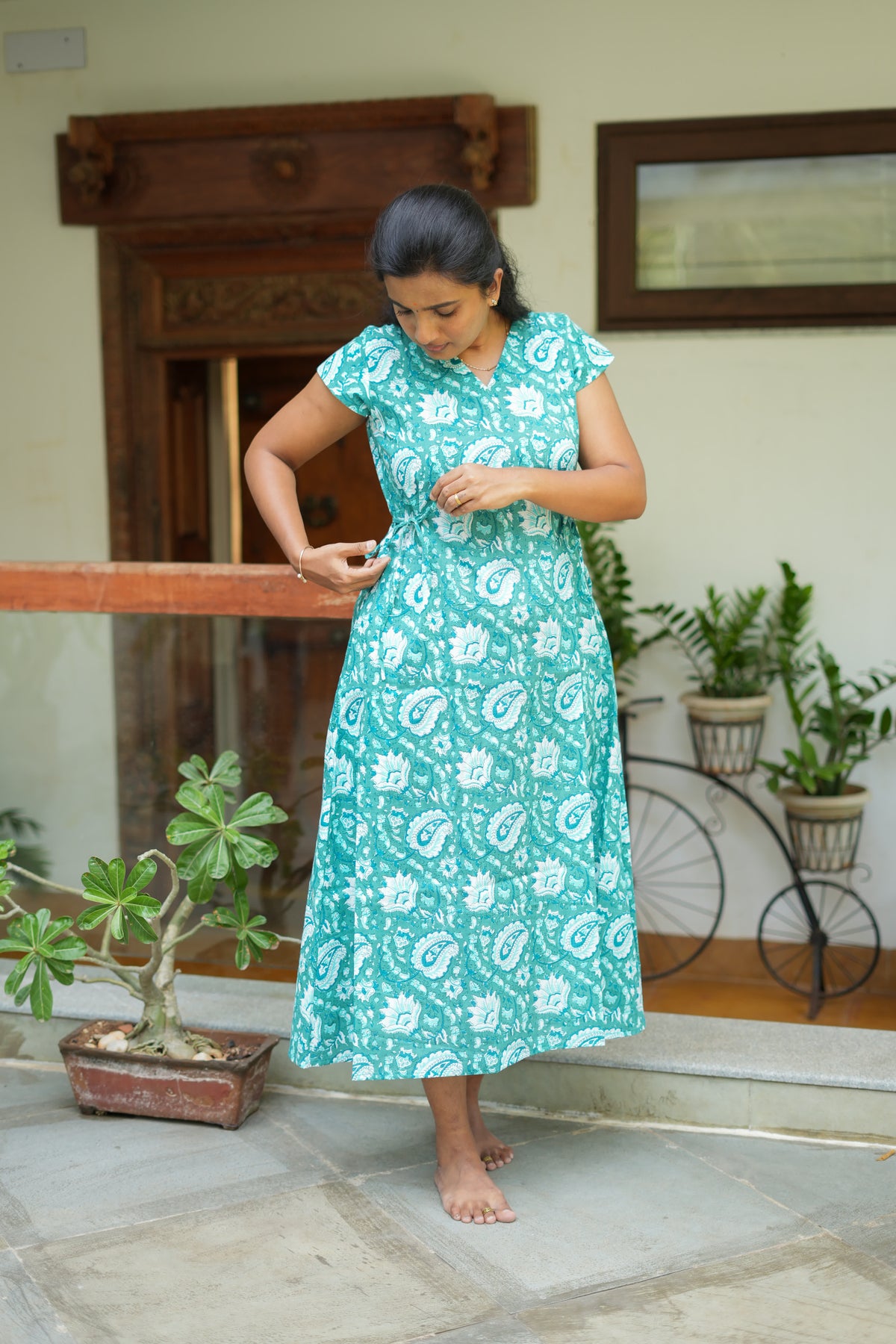 Side view showing adjustable waist tie on teal blue cotton nighty