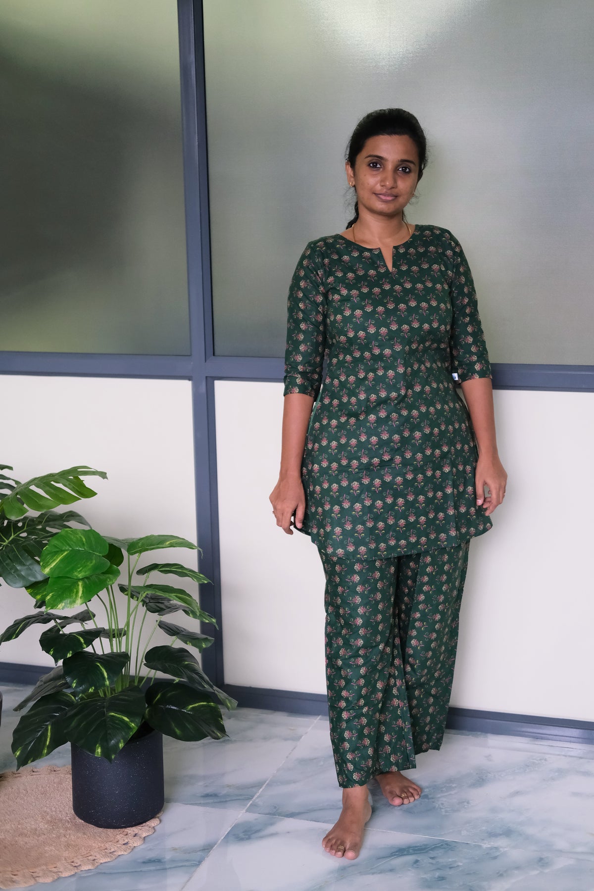 Full-length view of the Heera green cotton night suit featuring 3/4 sleeves and matching printed trousers.