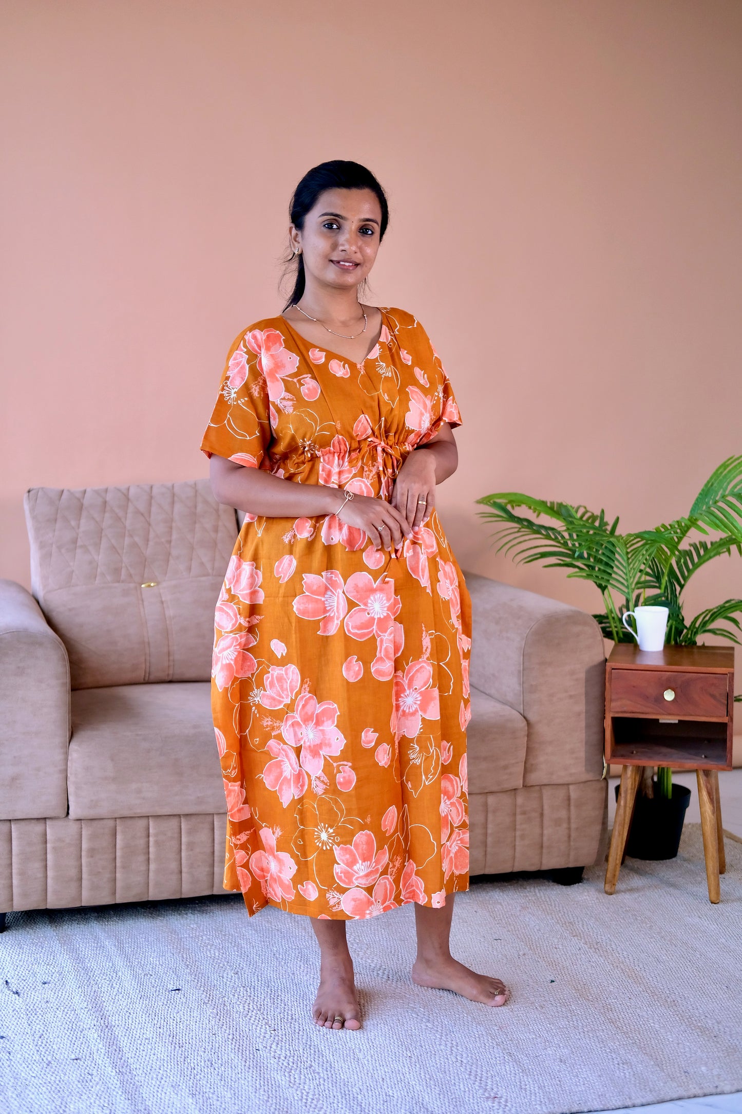 Comfortable cotton kaftan nighty in rust orange with a beautiful floral pattern.