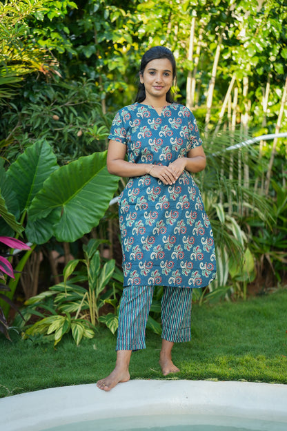 Comfortable teal green printed night suit with side pockets and relaxed fit pants.