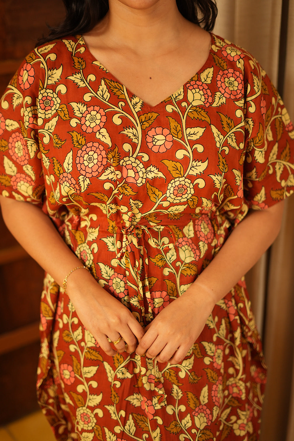 Detailed view of the traditional floral vine print on the brown cotton kaftan midi nighty