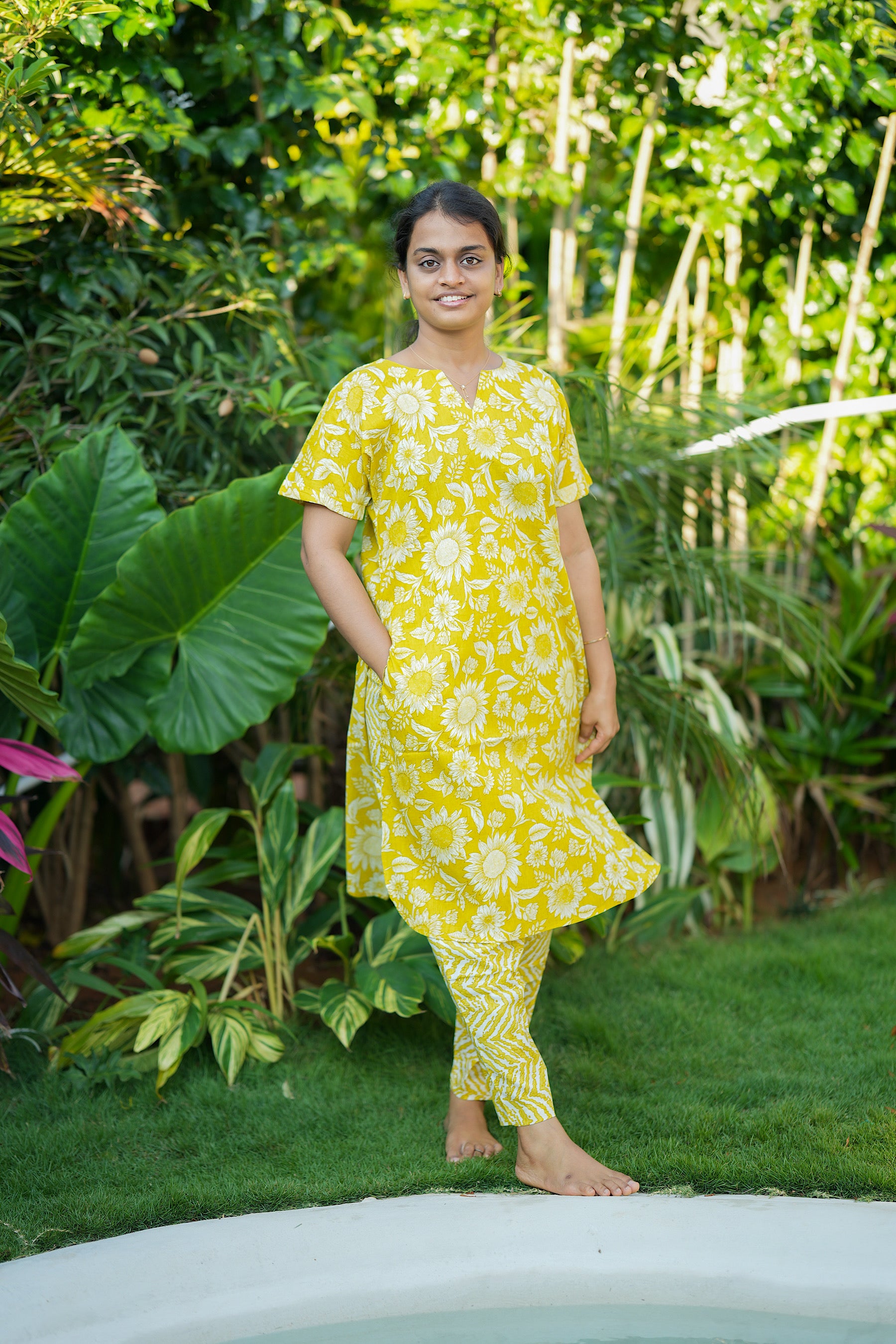 Relaxed fit yellow printed cotton loungewear set with convenient side pockets and a comfortable V-slit neckline.
