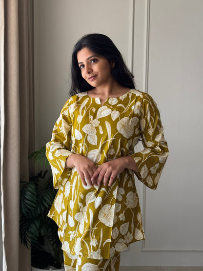 Close-up of the Heera printed cotton loungewear top showing the V-notch neckline and comfortable bell sleeve details.