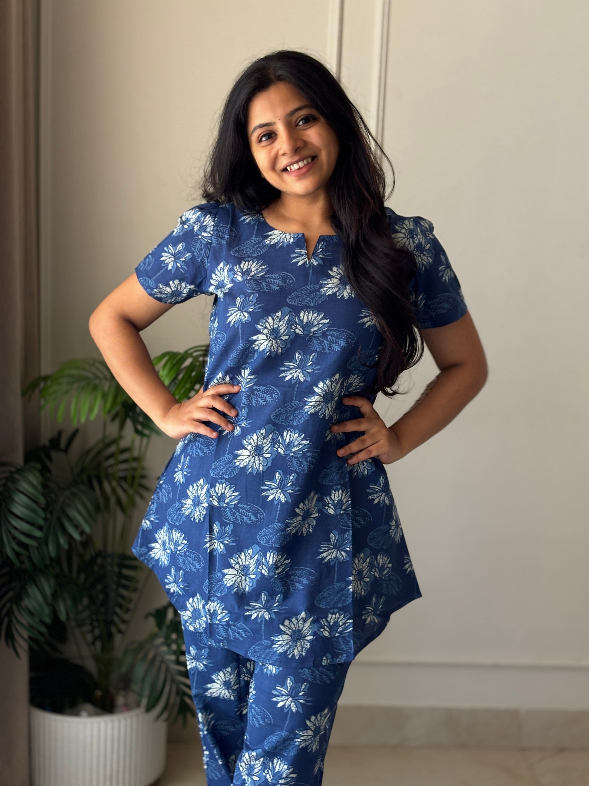 Full-length view of the blue floral cotton loungewear set with a relaxed-fit top and matching printed trousers.