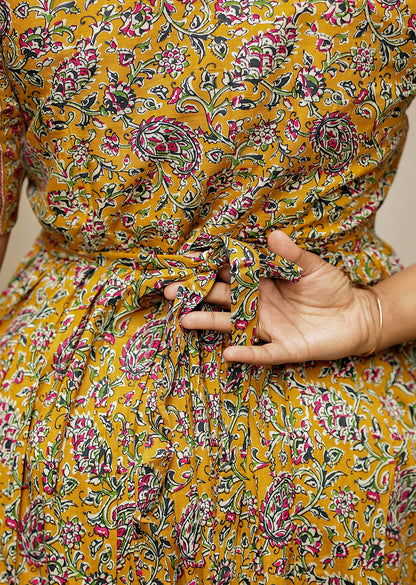 Back view of the cotton loungewear dress showing the adjustable tie-back belt