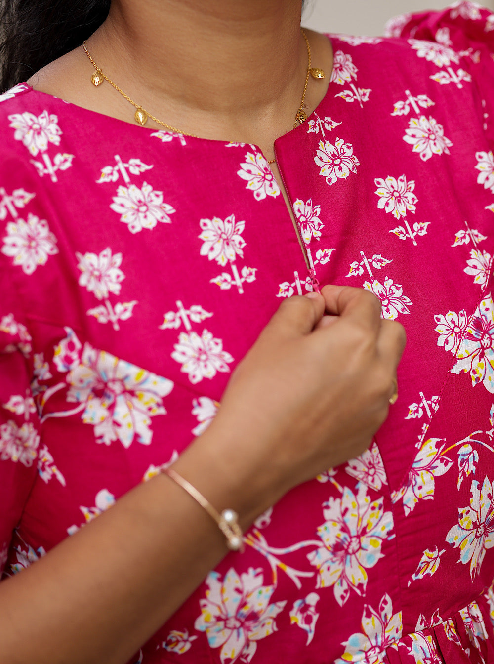 Close-up showing the easy-to-use front zipper detail on the pink floral nighty.
