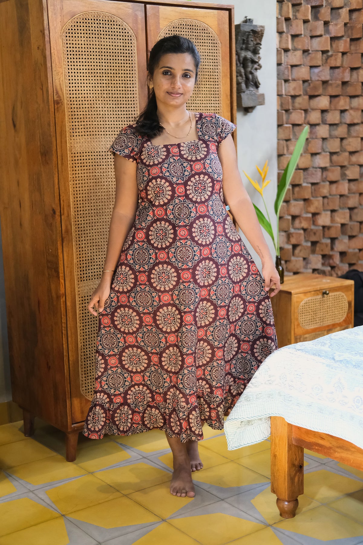 Full length view of printed midi nighty in maroon cotton