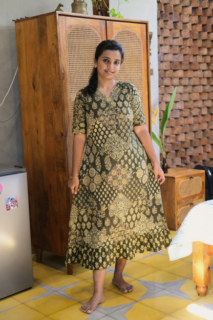 Full-length view of a ladies cotton nighty in olive green with traditional block prints