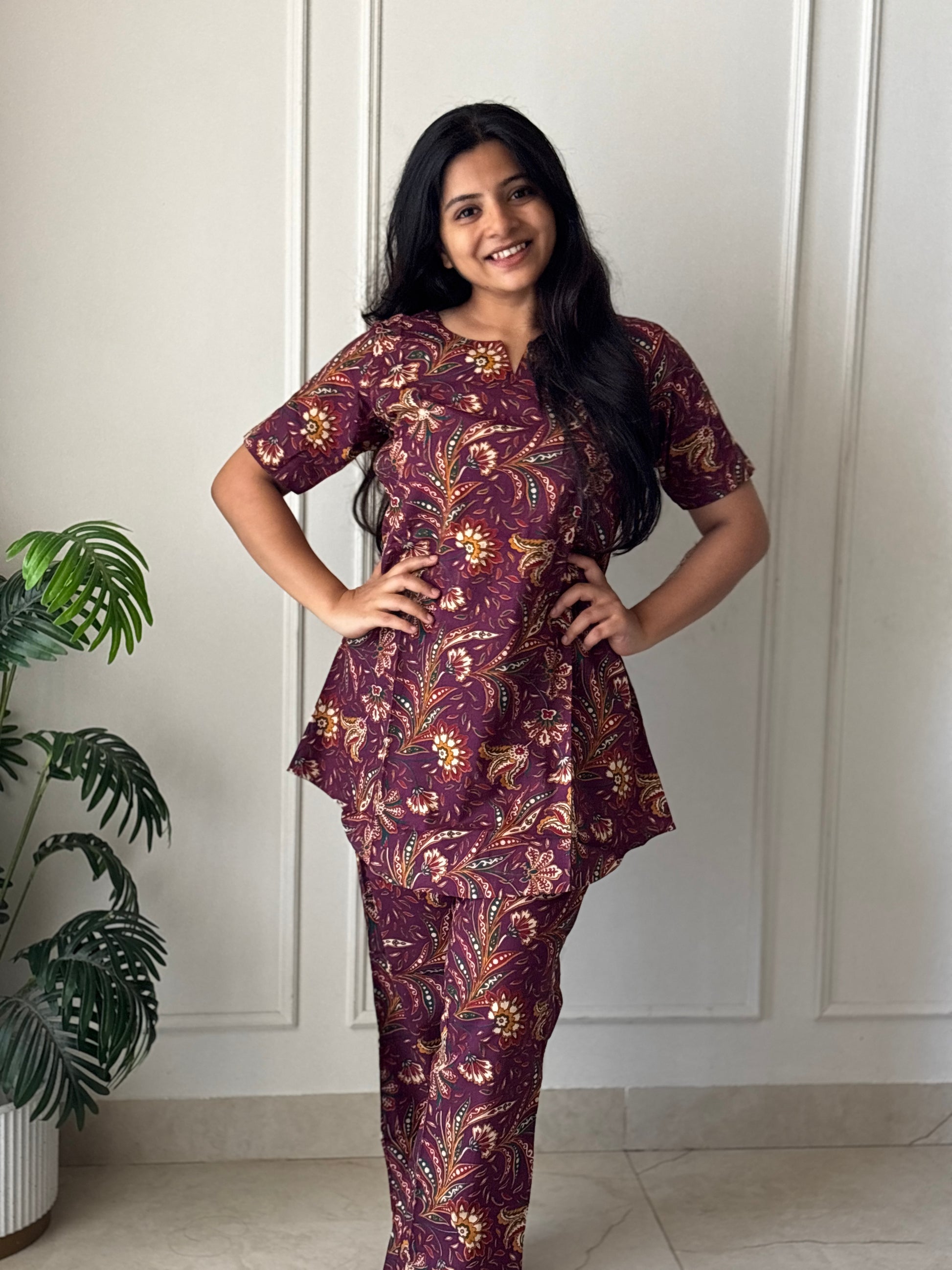 Front view of the Heera printed loungewear set in wine purple cotton with a V-notch neckline and straight pants.