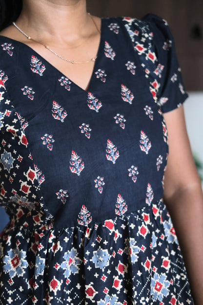 Close up of printed bodice on black cotton maxi nighty