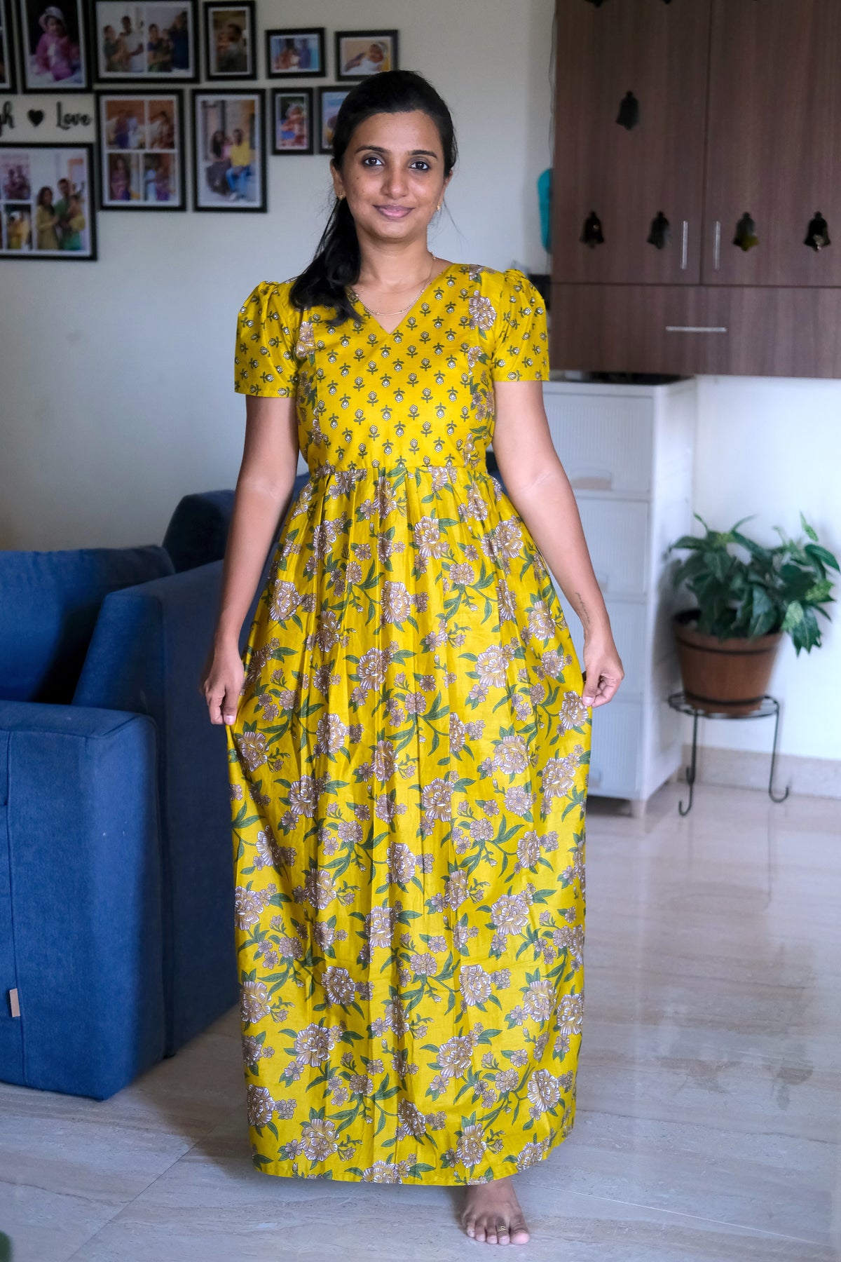 Full-length view of the yellow cotton nighty showing its relaxed fit and gathered waist.
