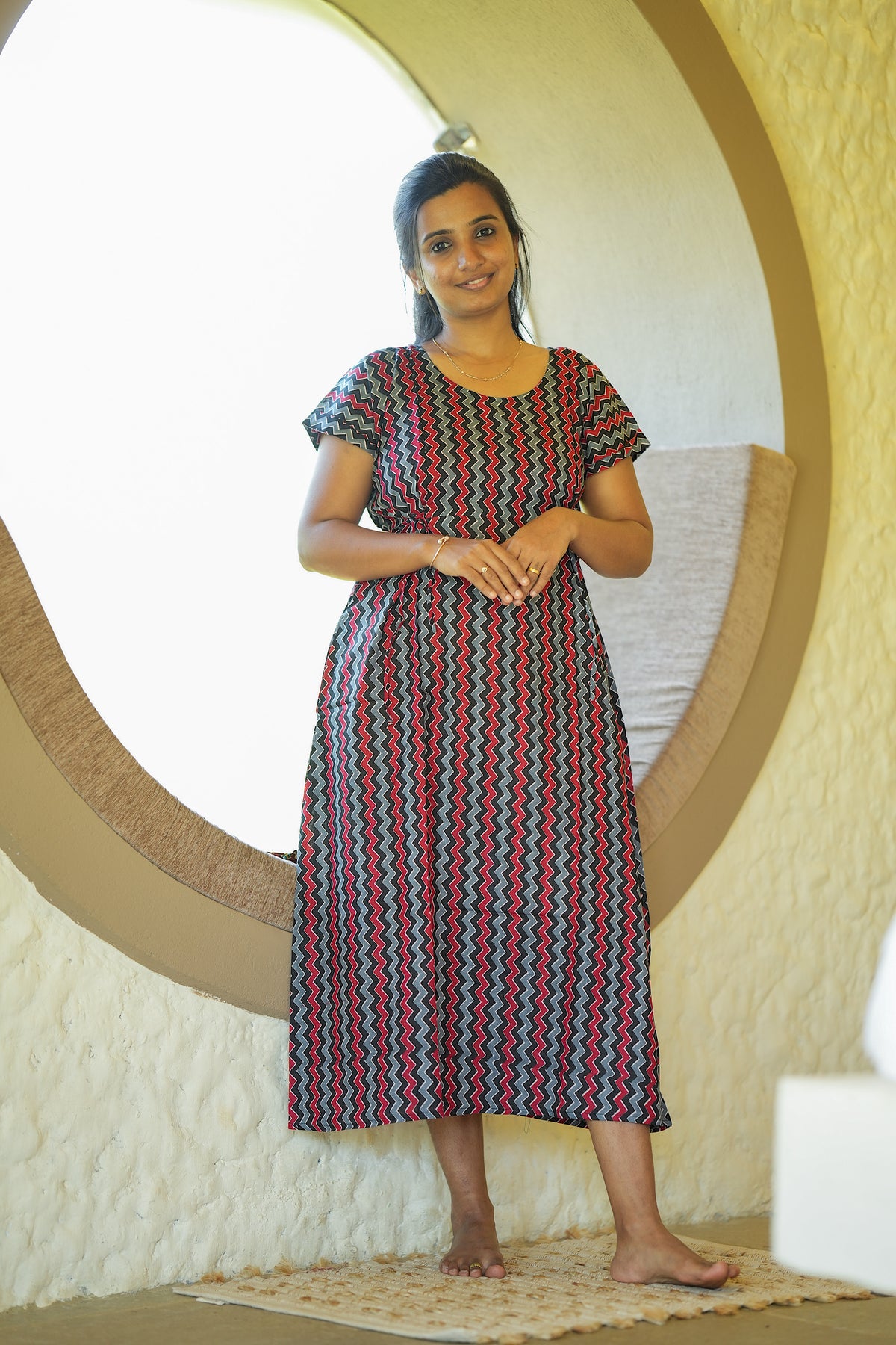 Tanvi black zig-zag printed ladies cotton nighty with short sleeves and adjustable waist tie.