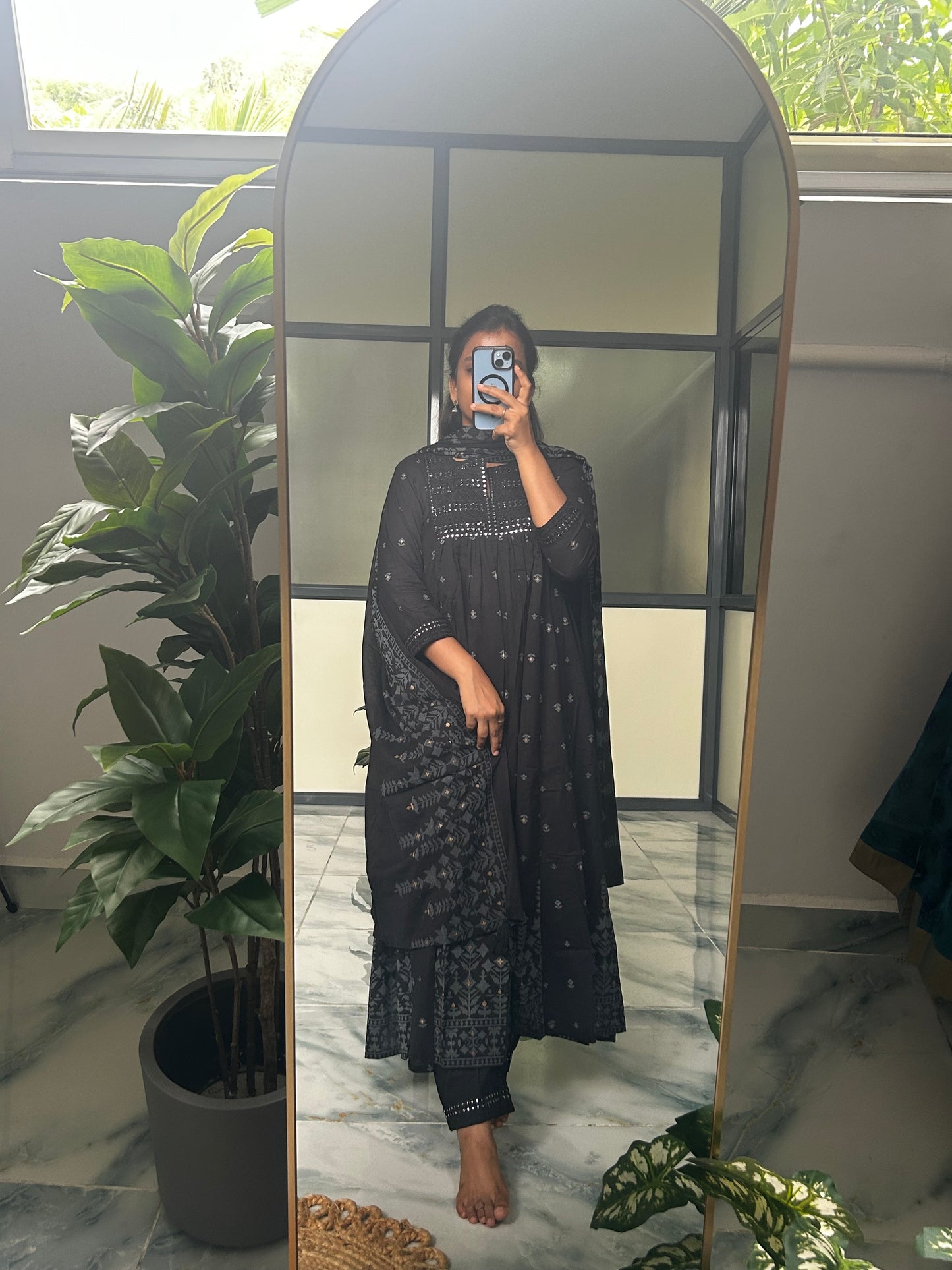 Three-piece black anarkali kurti set with matching pants and dupatta