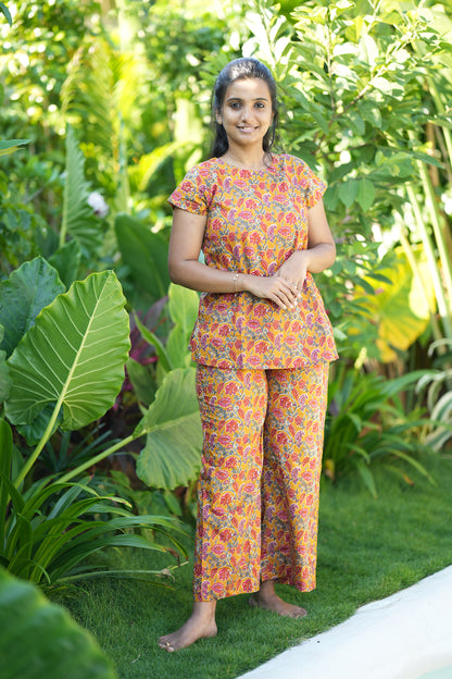 Yellow floral cotton night suit for women with high neck top and matching palazzo pants