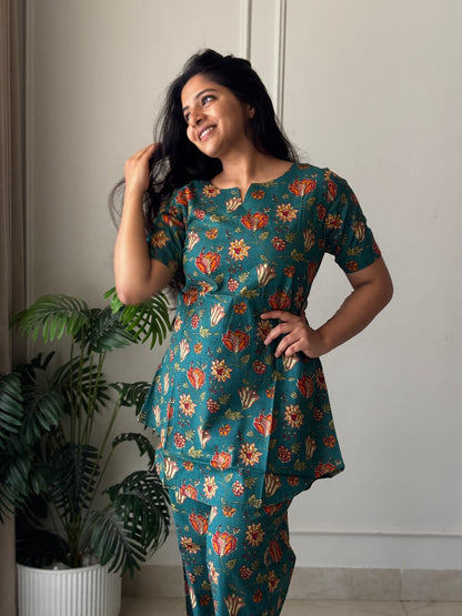 Side view of the printed loungewear set showing the relaxed fit and curved hemline of the tunic top.