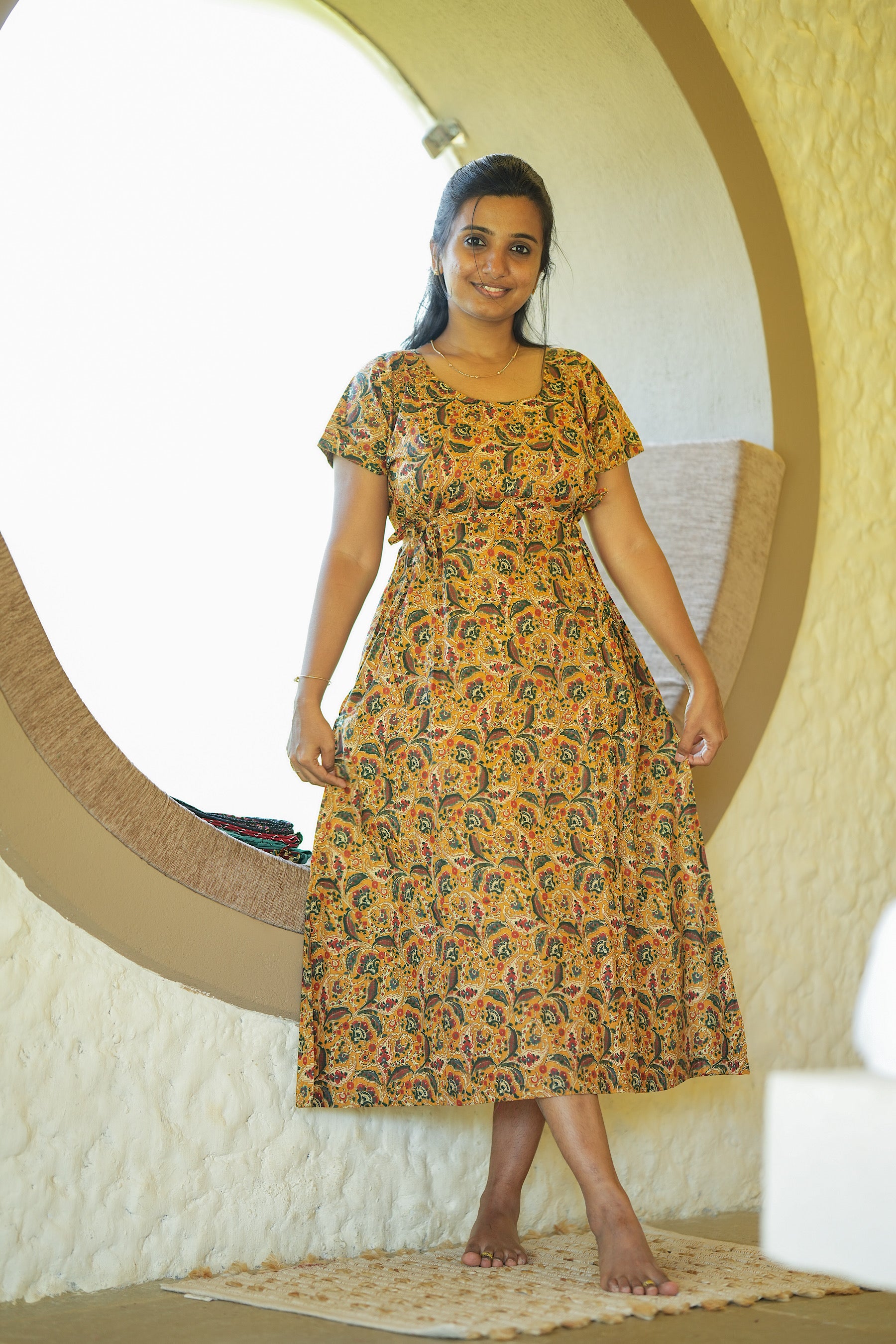 A-line cotton nighty in mustard yellow with short sleeves and side tie-ups