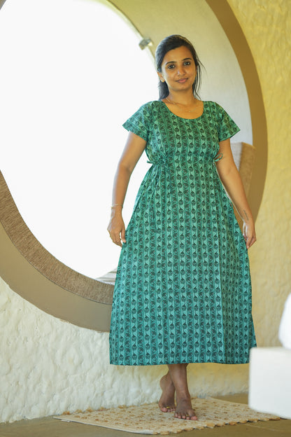 Comfortable green cotton nighty featuring a round neck and adjustable side ties.