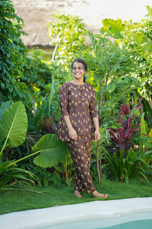 Ayla cotton night suit for women featuring a gathered peplum top and matching printed trousers.