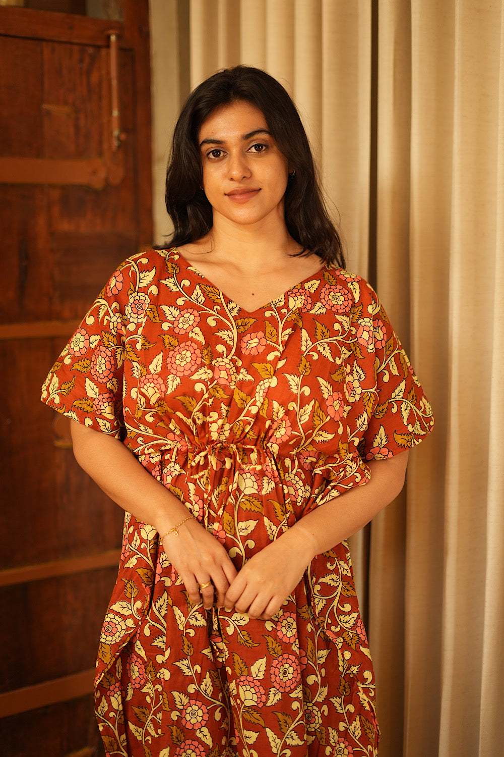 Close-up of the V-neckline and adjustable waist tie on the Nila cotton kaftan nighty