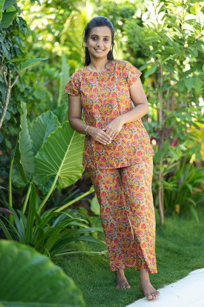 Front view of the Maya yellow printed night suit set in soft cotton fabric