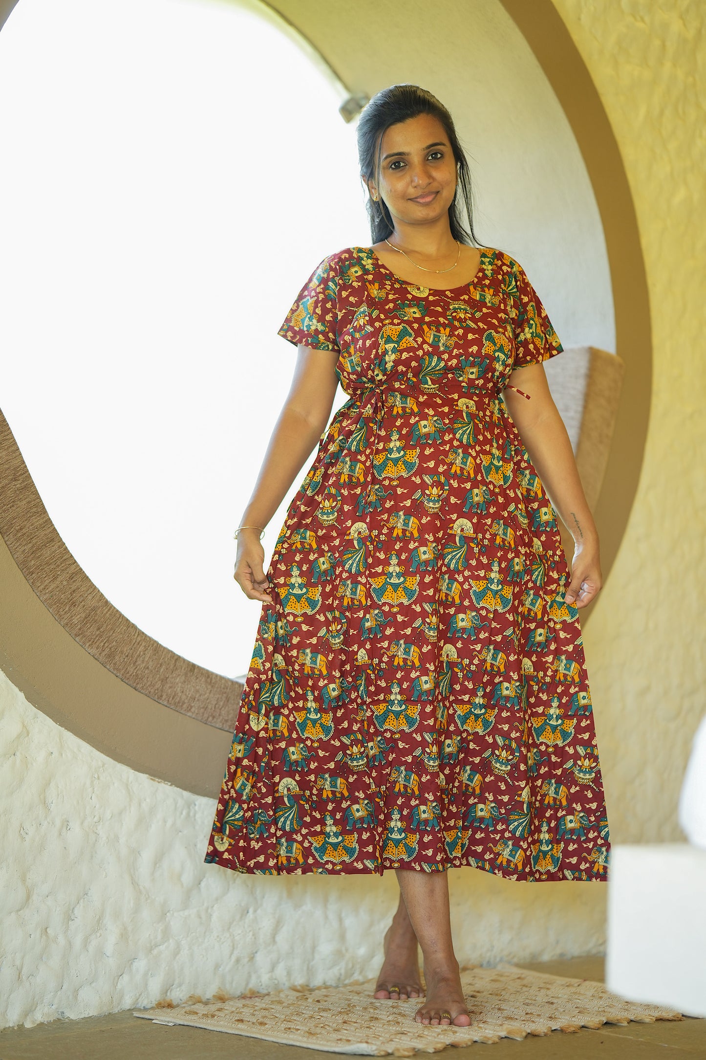 Full-length view of the maroon printed cotton maxi nighty with a flared silhouette.