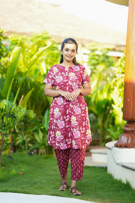 Berry pink floral printed cotton night suit for women featuring a long tunic top and matching straight pants.