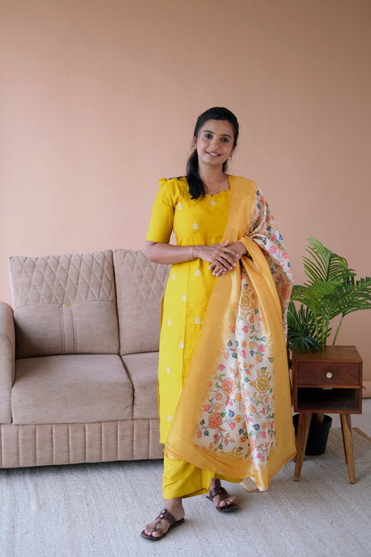 Brindha yellow kurti set with dupatta featuring a straight-cut embroidered yellow kurti, matching pants, and a floral printed dupatta.