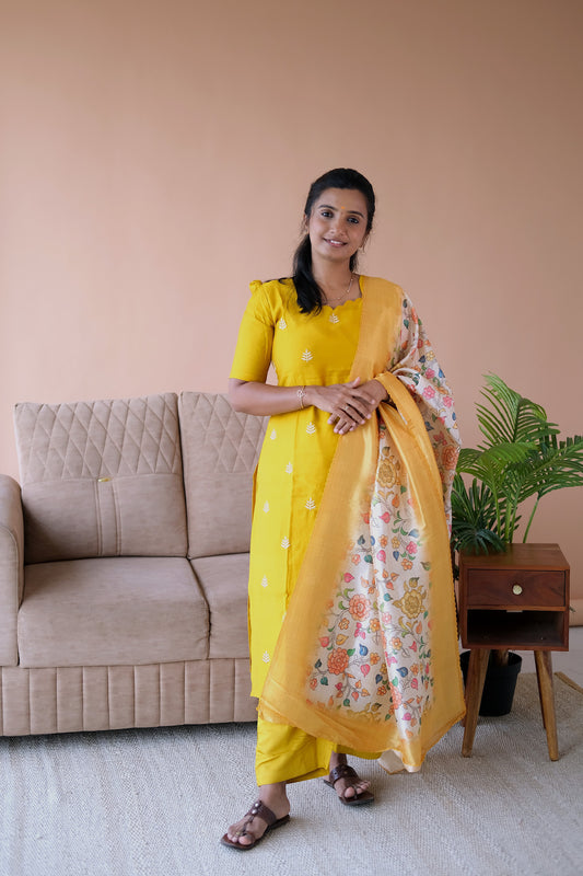 Brindha yellow kurti set with dupatta featuring a straight-cut embroidered yellow kurti, matching pants, and a floral printed dupatta.