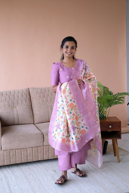 Three-piece embroidered kurti set in onion pink with matching straight pants and a floral printed dupatta.