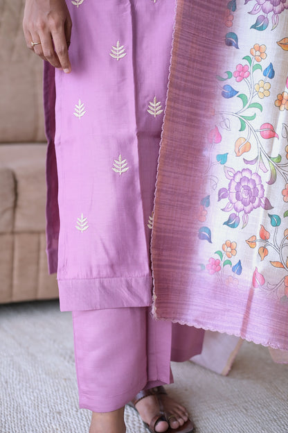 Detailed view of the straight-cut onion pink pants and the vibrant floral border of the dupatta.