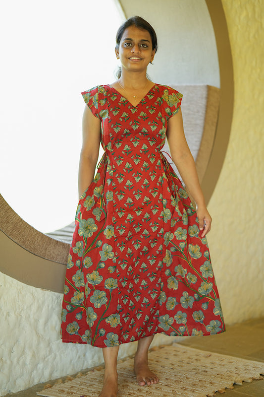 Red printed cotton maxi dress with adjustable side ties and V-neckline