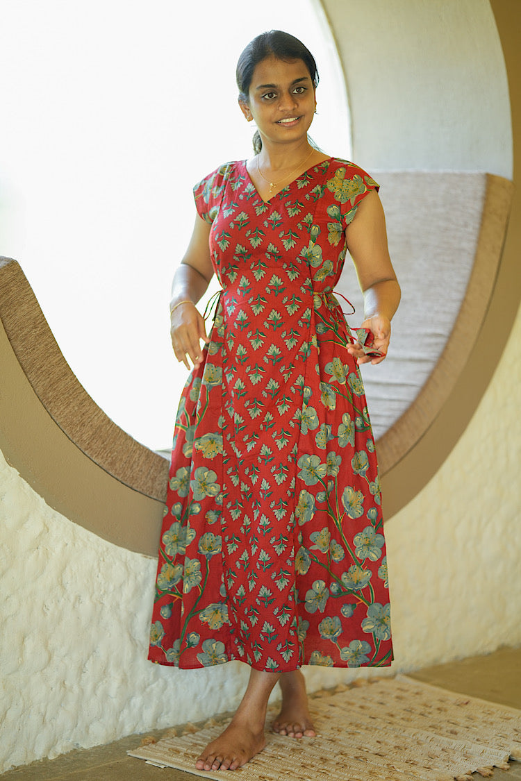 Feeding friendly dress in red cotton featuring side tie-ups with tassels