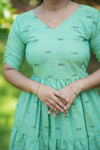 Detailed view of the soft slub cotton fabric and black geometric prints