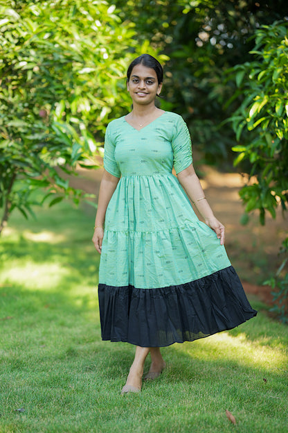 Full-length view of the Eyal printed long dress in green and black cotton