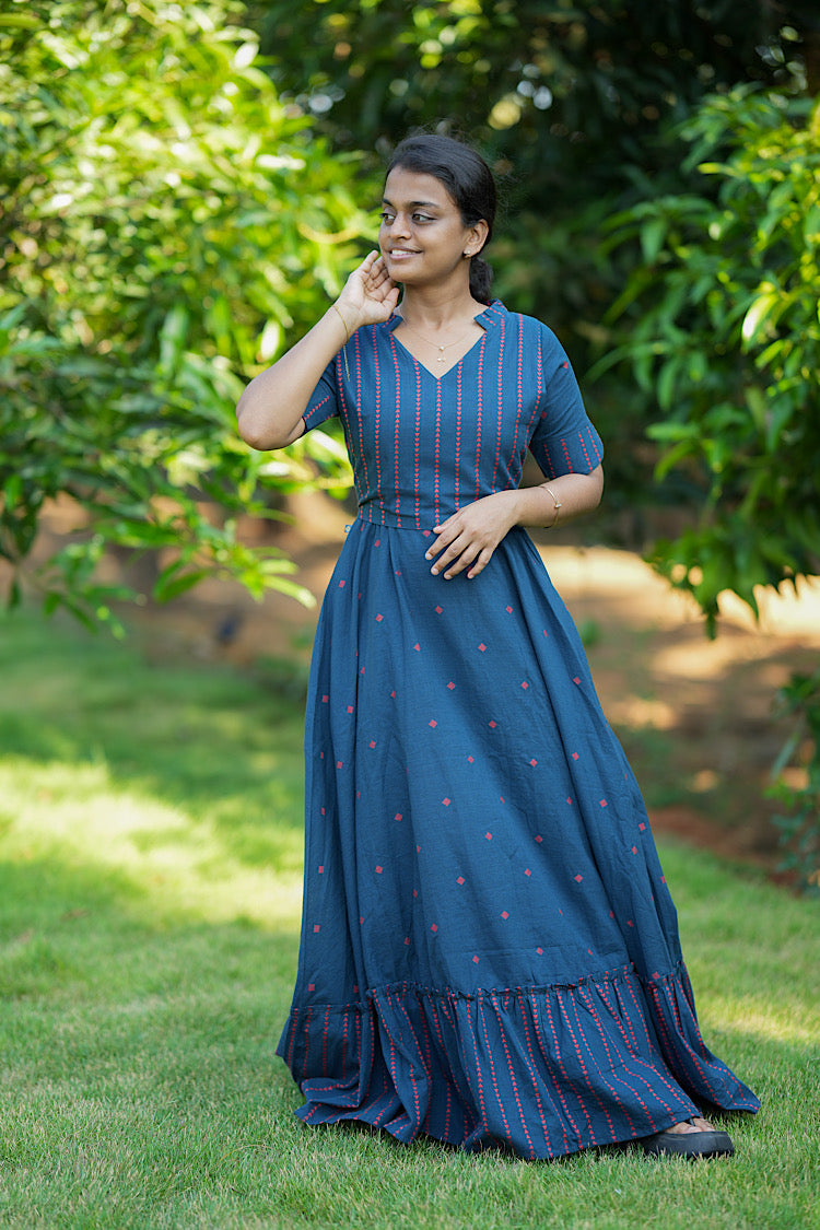 A-line blue cotton maternity dress with a structured stand collar and red diamond patterns.