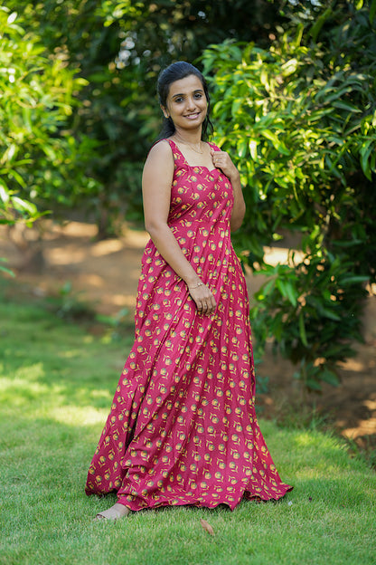 Sleeveless deep pink cotton maxi dress with a yellow floral bud print