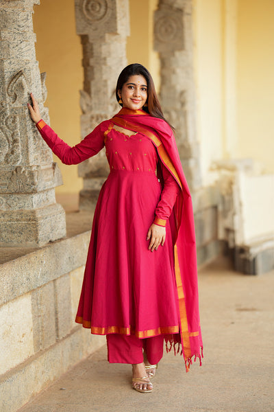 Full-length view of the red cotton anarkali suit set with a zari border dupatta and matching palazzo pants.