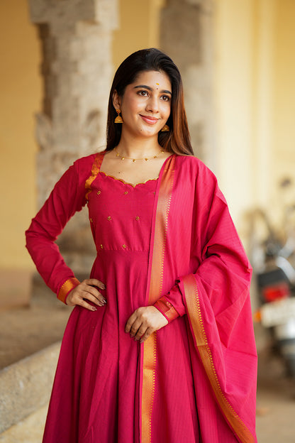 Three-quarter portrait of the elegant red cotton anarkali suit set showing the rich texture of Mangalgiri cotton.