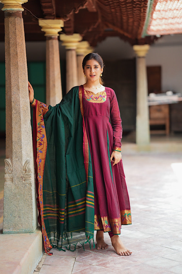 Full-length portrait of the maroon and green cotton anarkali suit set with Paithani borders.