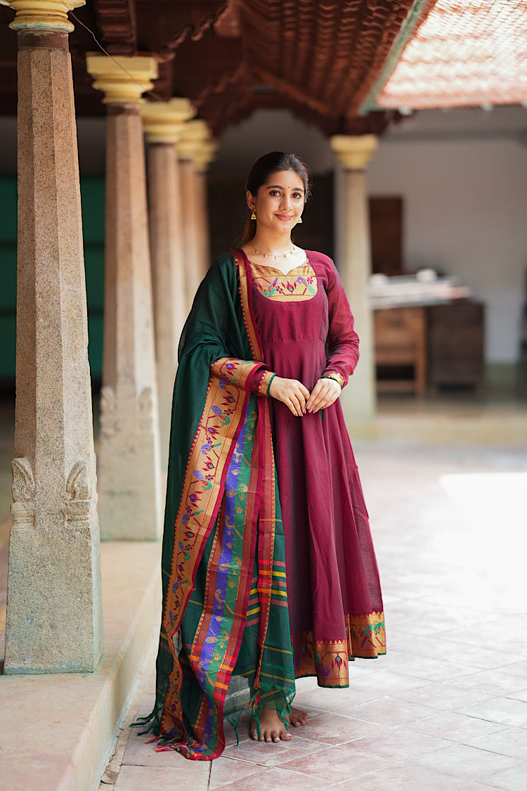Maroon cotton anarkali suit set with a dark green dupatta featuring woven Paithani borders.