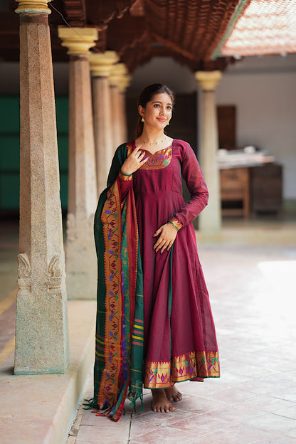 Elegant maroon cotton anarkali suit with dupatta showcasing traditional zari borders.
